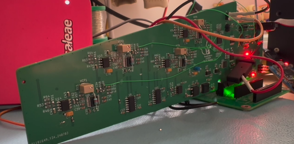 picture of a PCB with some lights on and some wires